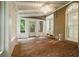 Bright sunroom with brick floors, multiple windows, and a ceiling fan at 245 Scotch Pine Ct, Alpharetta, GA 30022