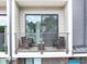 A relaxing balcony features two chairs and a small table, perfect for enjoying the outdoors at 701 Pryor Sw St # 5, Atlanta, GA 30315