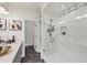 Modern bathroom featuring sleek double sinks, a walk-in shower, and stylish black and white patterned flooring at 701 Pryor Sw St # 5, Atlanta, GA 30315