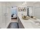 Stylish bathroom boasts modern double sinks, a walk-in shower, and beautiful black and white patterned floors, bedroom access at 701 Pryor Sw St # 5, Atlanta, GA 30315