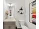 Bathroom featuring vanity with a gray cabinet, a sink, and decorative shelving at 701 Pryor Sw St # 5, Atlanta, GA 30315
