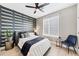 This bedroom has a ceiling fan, geometric accent wall and lots of light from the window at 701 Pryor Sw St # 5, Atlanta, GA 30315