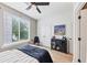 Bright bedroom with a large window, light wood floors, closet, and elegant furnishings at 701 Pryor Sw St # 5, Atlanta, GA 30315