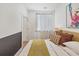 Bedroom featuring half-painted wall, queen bed, art, and natural light at 701 Pryor Sw St # 5, Atlanta, GA 30315