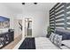 Stylishly decorated bedroom features a queen bed, decorative wallpaper and en suite bathroom at 701 Pryor Sw St # 5, Atlanta, GA 30315