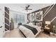 This bedroom features stylish wall art, a ceiling fan, and plenty of natural light from the window at 701 Pryor Sw St # 5, Atlanta, GA 30315