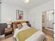 Bedroom featuring half-painted wall, queen bed and ensuite bathroom with shower at 701 Pryor Sw St # 5, Atlanta, GA 30315