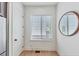 Bright breakfast nook featuring a window with blinds and a round mirror hanging on the wall at 701 Pryor Sw St # 5, Atlanta, GA 30315