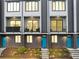 Beautiful townhome featuring brick facade, private balconies, and eye-catching, bright blue doors at 701 Pryor Sw St # 5, Atlanta, GA 30315