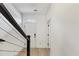 Bright hallway featuring light hardwood floors and white walls with a view of the entry door at 701 Pryor Sw St # 5, Atlanta, GA 30315