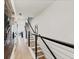 Hallway with black metal handrail and natural-colored wood stairs at 701 Pryor Sw St # 5, Atlanta, GA 30315