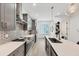 Modern kitchen with sleek gray cabinetry, stainless steel appliances, and quartz countertops at 701 Pryor Sw St # 5, Atlanta, GA 30315