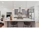 Stylish kitchen with gray cabinets, stainless appliances, and a large white island with seating at 701 Pryor Sw St # 5, Atlanta, GA 30315