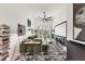 A bright living room features stylish zebra rug, comfortable seating, an entertainment center, and ample natural light at 701 Pryor Sw St # 5, Atlanta, GA 30315