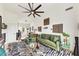 Spacious living room with a comfortable sectional sofa, unique decor, and an oversized ceiling fan for added comfort at 701 Pryor Sw St # 5, Atlanta, GA 30315