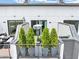 A rooftop deck with greenery and outdoor furniture offers a serene space for relaxation and entertainment at 701 Pryor Sw St # 5, Atlanta, GA 30315