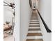 Bright staircase with wooden treads, a black railing, and a modern design at 701 Pryor Sw St # 5, Atlanta, GA 30315