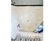 Bathtub featuring tiled walls with shower head and hardware in a modest space at 1386 Bluefield Sw Dr, Atlanta, GA 30310