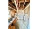 Kitchen needing renovation with exposed ceilings and wood cabinets, awaiting your personal design touch at 1386 Bluefield Sw Dr, Atlanta, GA 30310