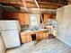 Kitchen needing renovation with natural wood cabinets and potential to become a modern culinary space at 1386 Bluefield Sw Dr, Atlanta, GA 30310