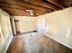 Spacious living room with exposed ceiling, offering potential for customization and renovation at 1386 Bluefield Sw Dr, Atlanta, GA 30310