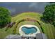 Aerial view showcases the pool, putting green, manicured landscaping, and outdoor amenities, perfect for relaxation and recreation at 1608 Mulberry Lake Dr, Dacula, GA 30019