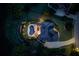 Aerial view of luxury home with swimming pool, lush landscaping, multi-car driveway, and mature trees at 1608 Mulberry Lake Dr, Dacula, GA 30019