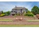 The backyard features a stone patio with a pool, a grilling area, and a fire pit with seating at 1608 Mulberry Lake Dr, Dacula, GA 30019