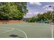 Outdoor basketball court and playground surrounded by trees, offering recreational space for residents at 1608 Mulberry Lake Dr, Dacula, GA 30019