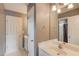 Bathroom with a single sink vanity, a large mirror, and ample storage at 1608 Mulberry Lake Dr, Dacula, GA 30019