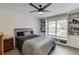 Cozy bedroom featuring built-in shelving and a large window at 1608 Mulberry Lake Dr, Dacula, GA 30019