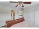 Spacious bedroom features a ceiling fan and access to the hallway and bathroom at 1608 Mulberry Lake Dr, Dacula, GA 30019