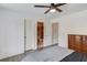 Bedroom featuring neutral walls, ceiling fan and easy access to the bathroom at 1608 Mulberry Lake Dr, Dacula, GA 30019