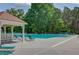 Relaxing community pool area featuring comfortable lounge chairs and shaded seating, ideal for unwinding at 1608 Mulberry Lake Dr, Dacula, GA 30019