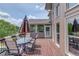Outdoor deck with patio furniture showcasing the exterior of the house and lake views at 1608 Mulberry Lake Dr, Dacula, GA 30019