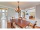 Elegant dining room featuring hardwood floors, a chandelier, and an open concept design at 1608 Mulberry Lake Dr, Dacula, GA 30019