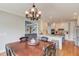 Dining area with a view into the kitchen and living area at 1608 Mulberry Lake Dr, Dacula, GA 30019