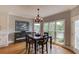 Cozy dining area with a view of the lake and an adjacent white cabinet at 1608 Mulberry Lake Dr, Dacula, GA 30019