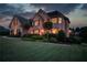 Charming brick home with manicured lawn, showcasing a blend of classic architecture and verdant landscaping at 1608 Mulberry Lake Dr, Dacula, GA 30019