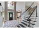 Inviting foyer with soaring ceilings, hardwood floors, and a grand staircase at 1608 Mulberry Lake Dr, Dacula, GA 30019