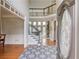 Inviting foyer featuring hardwood floors, staircase, and an open view to the living room at 1608 Mulberry Lake Dr, Dacula, GA 30019