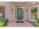 Elegant front door with decorative glass, sidelights, and brick entryway at 1608 Mulberry Lake Dr, Dacula, GA 30019
