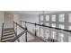 Upstairs hallway with beautiful trim overlooking the living room below at 1608 Mulberry Lake Dr, Dacula, GA 30019