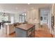 Bright eat-in kitchen features a large island, stainless steel appliances, and hardwood floors at 1608 Mulberry Lake Dr, Dacula, GA 30019