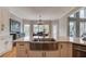 This kitchen boasts a stainless steel farmhouse sink, quartz countertops, and white cabinets at 1608 Mulberry Lake Dr, Dacula, GA 30019