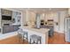 Modern kitchen with an island, a bar area, and stainless steel appliances at 1608 Mulberry Lake Dr, Dacula, GA 30019