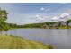 Scenic lake view with lush green landscape and neighboring homes creating a serene and inviting community atmosphere at 1608 Mulberry Lake Dr, Dacula, GA 30019