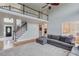 Expansive living room with a balcony, a staircase, and an open-concept kitchen at 1608 Mulberry Lake Dr, Dacula, GA 30019