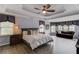Spacious main bedroom featuring trey ceiling, sitting area, and stylish decor at 1608 Mulberry Lake Dr, Dacula, GA 30019