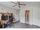 Bright office space with desk, storage, and access to the hallway and bathroom at 1608 Mulberry Lake Dr, Dacula, GA 30019